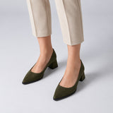 Olive suede pointed pump with low 5 cm flared block heel, worn on model, front — ECADRA