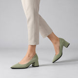 Pistachio suede pointed pump with low 5 cm flared block heel, worn on model, walking — ECADRA