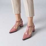 Rose gloss T-strap heels with wide strap, silver buckle and 5 cm flared heel, worn on model, front — ECADRA