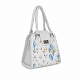 Side view of ECADRA White Metropolitan Charm Bag with botanical small wildflower and butterfly print and silver turn-lock clasp.